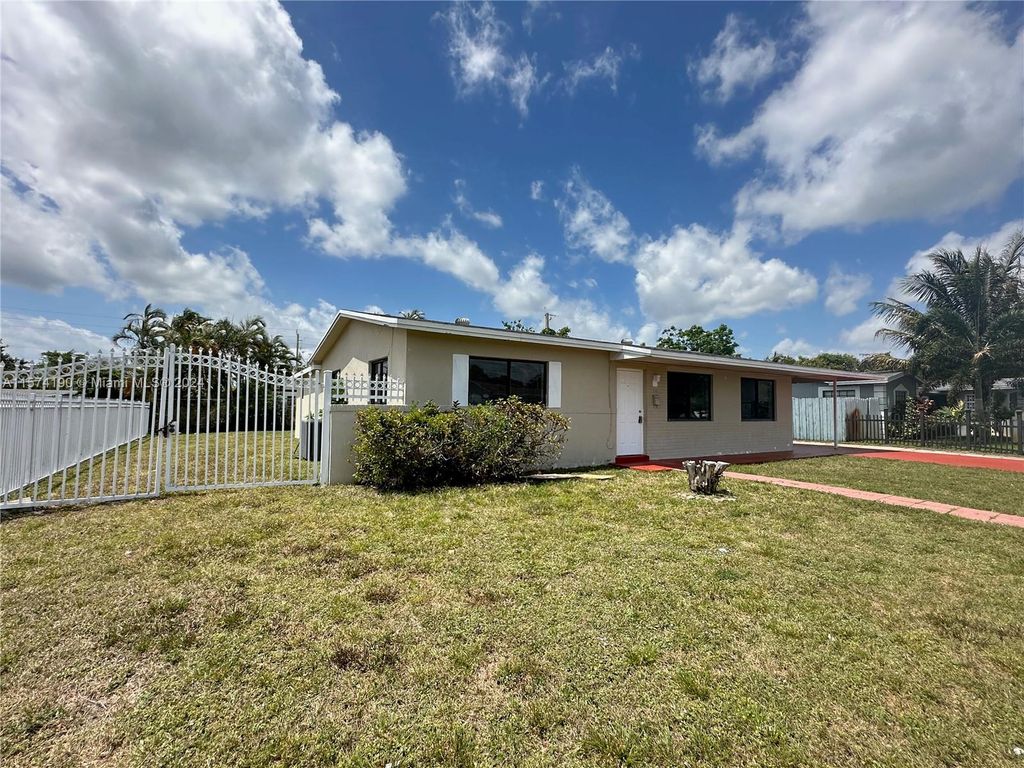 Photo of 1261 NW 54th Ter, Lauderhill, FL 33313 (MLS # A11574190)