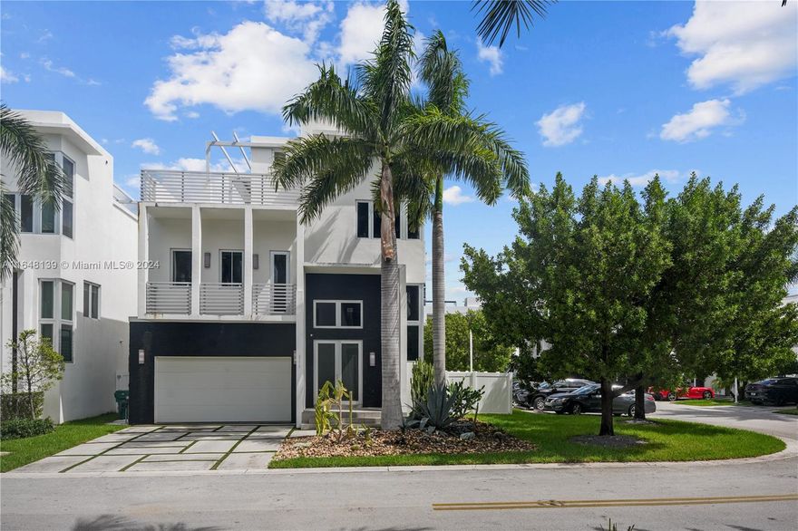 The luxurious  home in Oasis Square Park a gated 24 hour patrolled community. features contemporary three-story architecture. Situated on premium cornet lot, featuring a private elevator, heated jacuzzi on a rooftop terrace with full bathroom and summer kitchen. And includes 5 Bedrooms , 6 Bathrooms house features modern kitchen cabinetry ,premium  appliances ,refrigerated wine cellar, two car garage and 2 car driveway equipped with EV charger. 
 Prime location, near City Place, Downtown Doral, & important access routes such as the Palmetto Expressway and the Dolphin Expressway, facilitating travel to other areas of Miami and surroundings. 15 minutes from the airport and close to the Downtown Doral, which hosts a variety of shops, gourmet restaurants, cafes, and entertainment options.