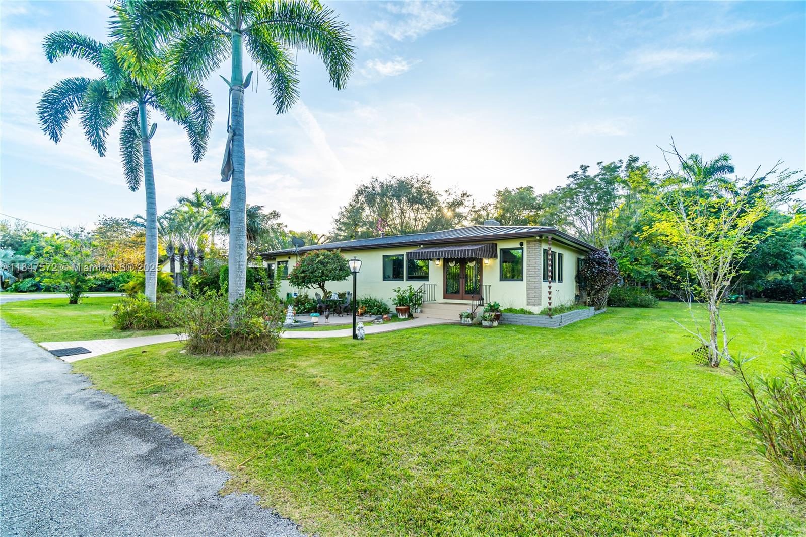 The look is over with this fully renovated Homestead stunner. Situated on 2.5 acres this tropical paradise features mature landscaping, fruit trees, custom pony barn, chicken coop and bird aviary. Step out into your private oasis and leave the world behind. In-law quarters on property. Other features include impact windows/doors, metal roofs, new A/C units and LVP flooring. Minutes from shops, restaurants and highways.......country living at it's finest!