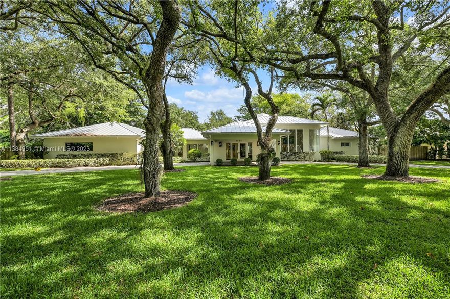 Pinecrest Tropical Estate. Tucked amid a lush grove in Miami’s most desired neighborhood, this completely renovated (2016) home embodies the S. Fla. dream that’s made our city a global favorite. Sunshine lights up your life, pouring into every room thru long banks of impact glass doors & floor-to-ceiling windows. You’ll never tire of luxuriating in & getting compliments on the many custom design touches--from chic chandeliers adorning beamed ceilings, to a sprawling kitchen w/a giant Calacatta gold marble plumbed island, a 5-star master bath suite, spectacular built-ins & so much more. And that’s before even heading outside, where the huge & totally private yard harbors a swimming pool, tennis/pickleball/basketball half-court & a broad covered terrace. Metal roof. 2CG converted to storage.
