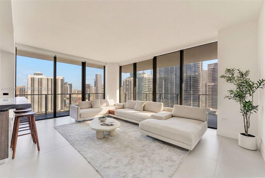 Indulge in this exquisitely reimagined 2/2.5 residence at The Rise Brickell City Centre that offers sweeping sunrise views over Biscayne Bay & the Miami skyline with floor-to-ceiling windows & a generous wraparound balcony. Every detail has been curated to perfection—from the grand 48x48 Gubi porcelain tile flooring to the sleek, modern kitchen with bespoke Italian cabinetry, honed marble countertops, Bosch appliances. The spa-inspired primary bathroom is a masterpiece in design, featuring a freestanding soaking tub & luxurious 120x120 Eco Ceramics wall tiles. Immerse yourself in a lifestyle of indulgence with exclusive access to 5-star amenities: a fitness center, heated pool, valet, Hammam spa, steam room, & more—just steps from the world-class shopping & dining of Brickell City Centre.
