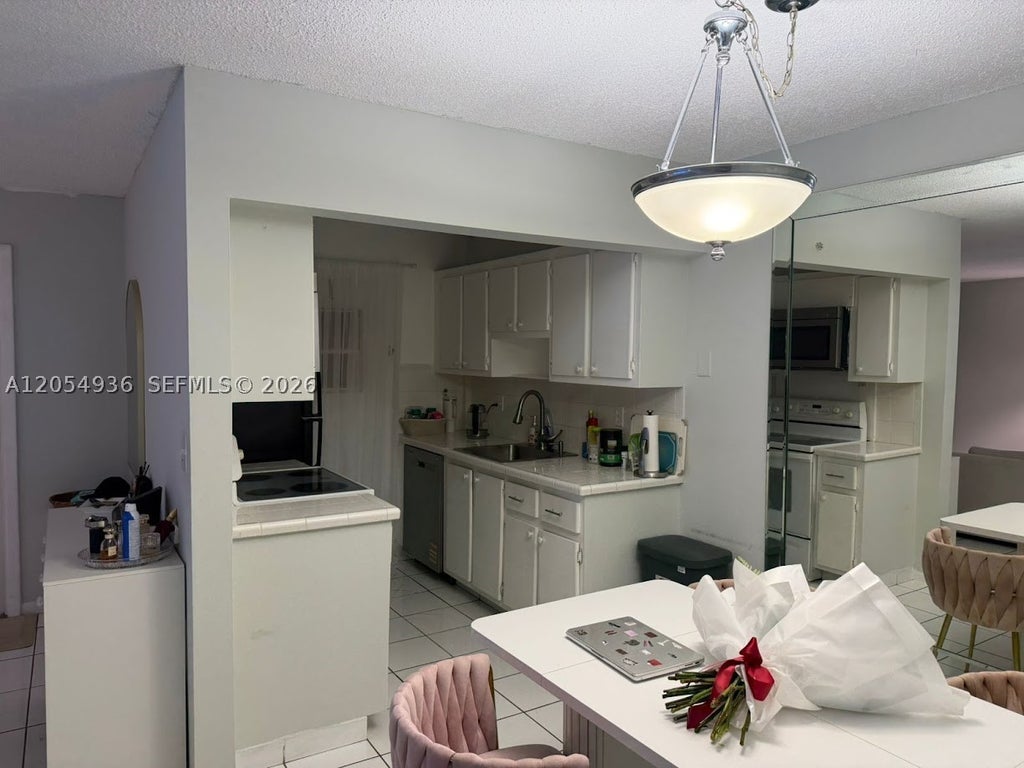 Photo of 2420 Diana Dr #302, Hallandale Beach, FL 33009 (MLS # A12054936)