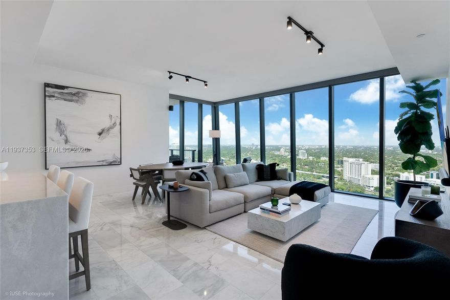 High-floor 03-line corner residence at Echo Brickell, one of Brickell’s most exclusive, low-density, and highly sought-after boutique towers. This 2 Bed, 2.5 Bath flow-through home offers open city skyline views with bay and water vistas, wrapped in floor-to-ceiling glass and filled with exceptional natural light. An expansive terrace with summer kitchen and built-in BBQ creates seamless indoor-outdoor living, ideal for entertaining. The open kitchen and living area is designed for scale and flow, anchored by polished marble floors and countertops with waterfall island, Italkraft Italian glass cabinetry, motorized shades, premium Wolf and Sub-Zero appliances. Spacious primary suite includes a soaking tub, separate shower, dual vanities, and walk-in closet. Full-size Electrolux washer/dryer in unit. Fully integrated smart home system with audio, lighting, and secure keyless entry. Two valet parking spaces.
Echo Brickell offers a resort-style infinity pool with food and beverage service, state-of-the-art fitness center, 24/7 concierge, valet, and security. A refined, turnkey corner residence in one of Brickell’s most coveted boutique addresses.
