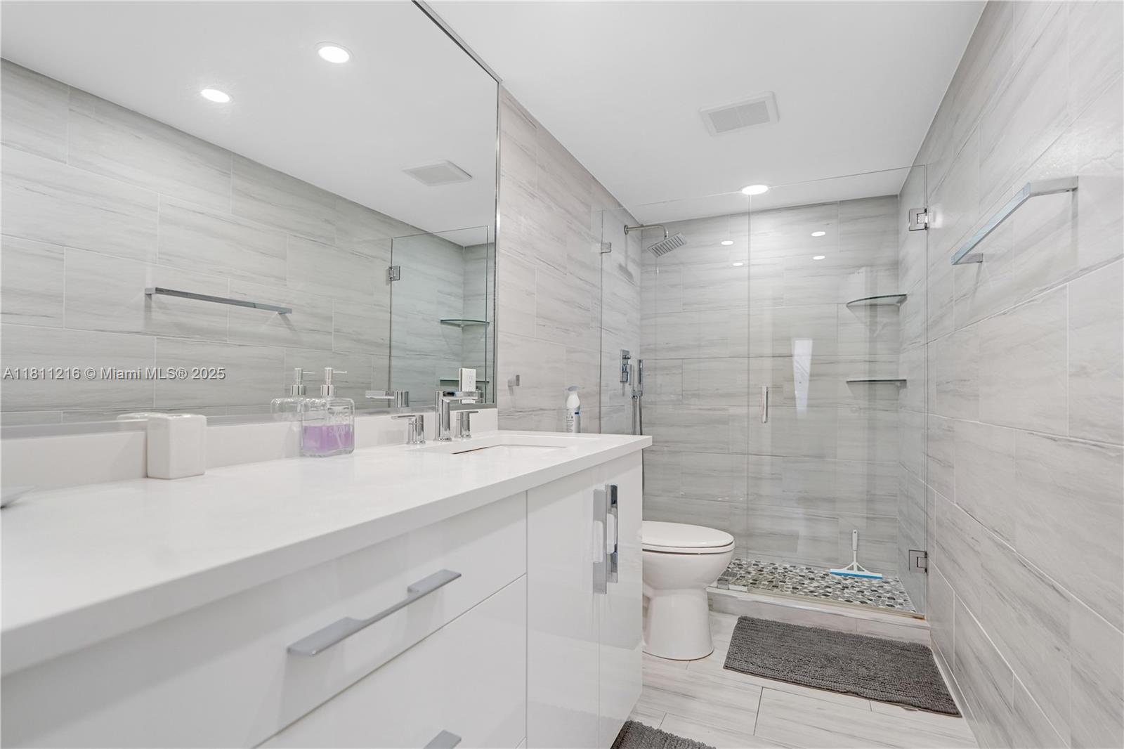 Fully renovated 2-bed, 2-bath condo with oversized terrace in sought-after Golden Isles! This stylish unit features high-end finishes, modern kitchen with quartz countertops & stainless steel appliances, and a spacious walk-in closet. Enjoy indoor-outdoor living with large sliding doors that open to your private terrace. The building offers a waterfront pool with Intracoastal views, fitness & bike rooms, social lounge, laundry facilities, and assigned parking. Pet-friendly and short-term rentals allowed after purchase. Prime Hallandale location close to beaches, shopping, Gulfstream Park & dining. Move-in ready for seasonal or full-time living!