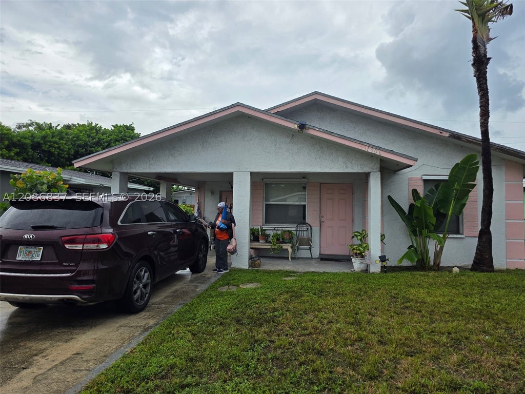Photo of 1306 W 23rd St, Riviera Beach, FL 33408 (MLS # A12086837)