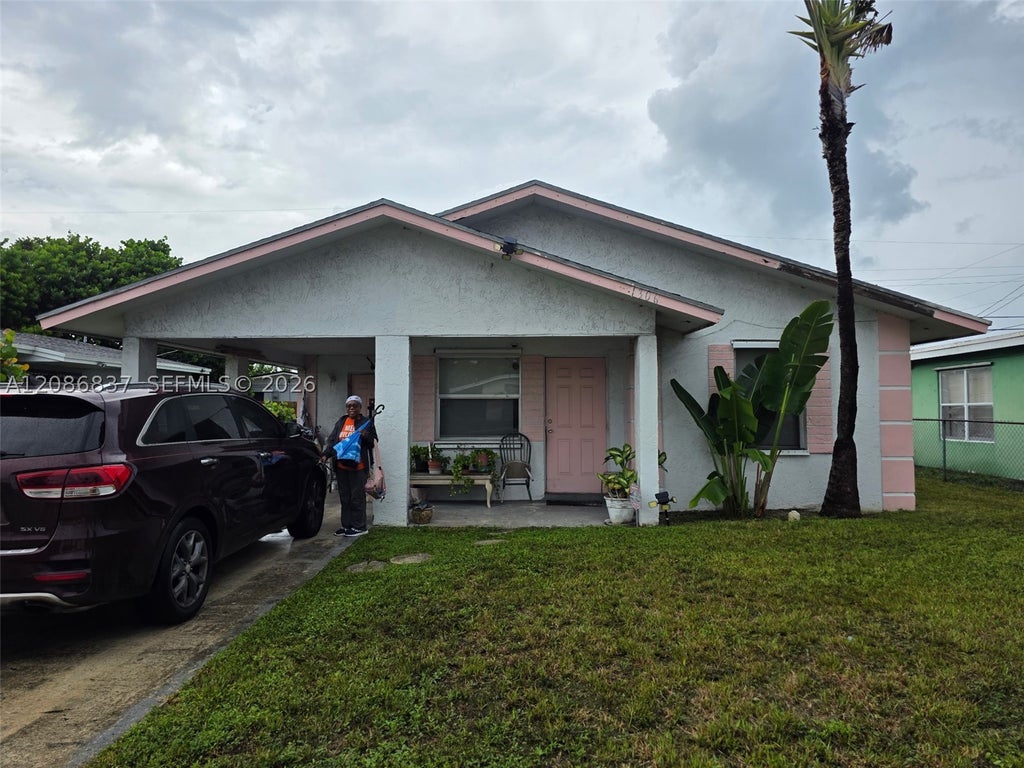 Photo of 1306 W 23rd St, Riviera Beach, FL 33408 (MLS # A12086837)