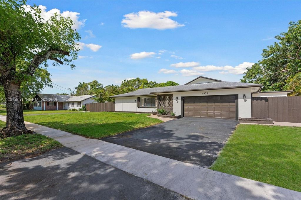 Photo of 401 SW 63rd Ter, Plantation, FL 33317 (MLS # A12005851)
