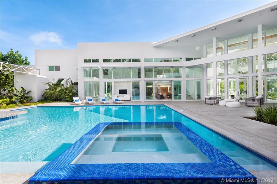 *Domus Solaris*: A new height in sustainable luxury. Over 11,000 sq ft of soaring spaces and window walls of impact glass, this house is the epitome of resilient and sustainable construction in Pinecrest. Grand, 28-Ft entry surrounded in glass. Concrete shell, concrete roof, commercial grade TPO roof membrane, stucco exterior. Corner lot, walled for privacy and security, 3 gated entrances, Control4 Automation, mature oaks and lush landscaping, 60 x 120 ft grass play field. Earned LEED Gold Certification and meets WELL Building standards. Resort-style, dual waterfall pool with pool house. Perfect family retreat. Highest elevation in Pinecrest. Half-mile by sidewalk to Pinecrest Community Center, Pinecrest Gardens. In Pinecrest Elementary School District. Tree-lined street.