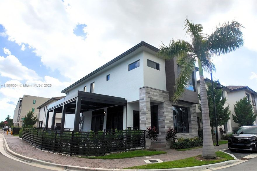 Built in 2023, this corner-lot home in Doral offers upgrades throughout, a peaceful low-traffic location, and prime commuting access. Features include a bright interior with remote-control blinds, high-end kitchen (Italian style) cabinets and appliances, new patio with pergola, motorized blinds, and BBQ area with grill, griddle, wine cooler, and ice maker. Garage with slat-wall storage, workshop desk, and bike lift. Upstairs bedrooms with private baths, primary suite with two walk-in closets. Two-car garage plus 2 extra paver parking spaces. Steps from CityPlace, Downtown Doral shops, restaurants, schools, and cultural center.