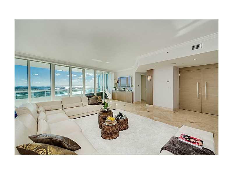 Spectacular panoramic views await at this gorgeous, floor-through 3 bedroom, 3.5 bathroom + den waterfront sky-home. Custom double-doors open from your private elevator foyer directly into the wide open living areas where the eye is immediately drawn outs ide to wide bay views & dynamic Miami skyline. Top-of-the-line eat-in kitchen w/ocean & beach views. All en-suite bedrooms. Two huge balconies. Lux building w/full amenities & access to private club, LaPiaggia. Prime South of Fifth location. Call today.