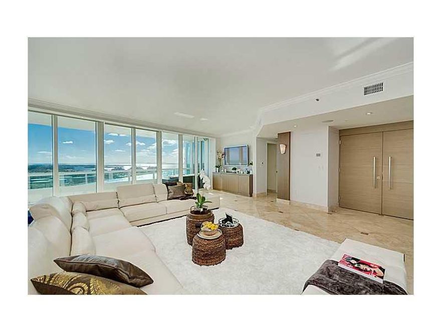 Spectacular panoramic views await at this gorgeous, floor-through 3 bedroom, 3.5 bathroom + den waterfront sky-home. Custom double-doors open from your private elevator foyer directly into the wide open living areas where the eye is immediately drawn outs ide to wide bay views & dynamic Miami skyline. Top-of-the-line eat-in kitchen w/ocean & beach views. All en-suite bedrooms. Two huge balconies. Lux building w/full amenities & access to private club, LaPiaggia. Prime South of Fifth location. Call today.