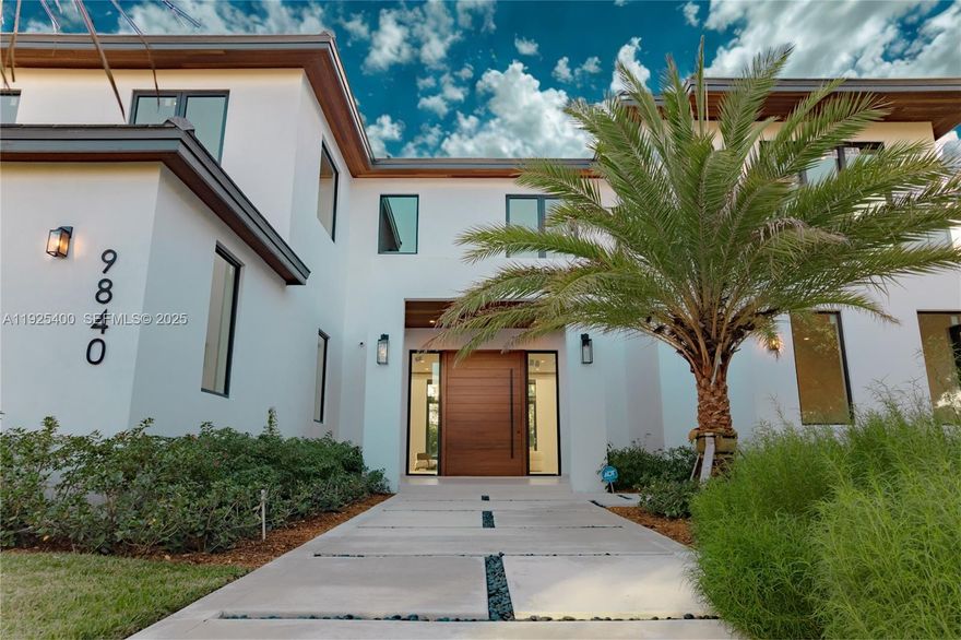 New Construction 2025. Experience Pinecrest living at its finest in this classic-with-a-modern-twist masterpiece, offering 8,143 sq. ft. of total construction and 6,841 sq. ft. under A/C. Perfectly positioned on a 15,225 sq. ft. corner lot, this 6-bed, 7.5-bath luxury residence was designed for those who appreciate sophisticated craftsmanship, elevated design, and effortless indoor–outdoor living. Step into a home bathed in natural light, enhanced by expansive windows and double-height panoramic views in the main living room. The open layout is complemented by a chef-inspired kitchen featuring top-tier luxury appliances, wolf and subzero, an oversized island, and a walk-in pantry. The resort-style backyard offers a sparkling saltwater pool, heated spa/jacuzzi, sun-drenched terraces, and generous outdoor areas ideal for entertaining. A car enthusiast’s dream, the property includes a 3-car garage with lift capability plus an additional 11-car driveway capacity. Retreat to the massive primary suite, a true sanctuary with a spa-inspired bathroom featuring a wet room, dual vanities, and a spectacular custom oversized closet that feels like its own boutique. Each Suite offers ample space, en-suite bathrooms. Every detail was thoughtfully curated, including the integration of Valentina Bilbao’s fine art, perfectly complementing the home's architectural elegance. A rare opportunity to own a brand-new luxury residence in one of Pinecrest’s best location. Opening this weekend.
