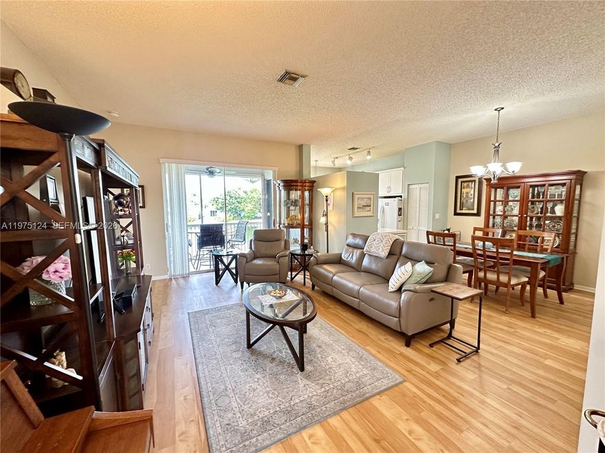 This large Corner 3-bed, 2-bath condo, with a garage, 1,650 square feet, and stunning lake view, is in the desirable Grand Palms gated community in West Pembroke Pines. This very well-maintained unit features a unit laundry room, upgraded Luxury Vinyl Flooring, Kitchen, and Bathrooms,  Accordion Shutters, 2024 AC, and 2014 Water Heater. The seller will give the buyer a credit at closing to cover six months of condo fees with a full price offer. Condo fee includes Internet, Basic Cable, Alarm, Water, Sewer, Trash, exterior Insurance, Exterior Pest Control, Guard Gate,  New Roof, exterior painting, community amenities, ensuring a hassle-free lifestyle. There are no assessments. 
$1billion+ project one step closer to coming to Grand Palms.