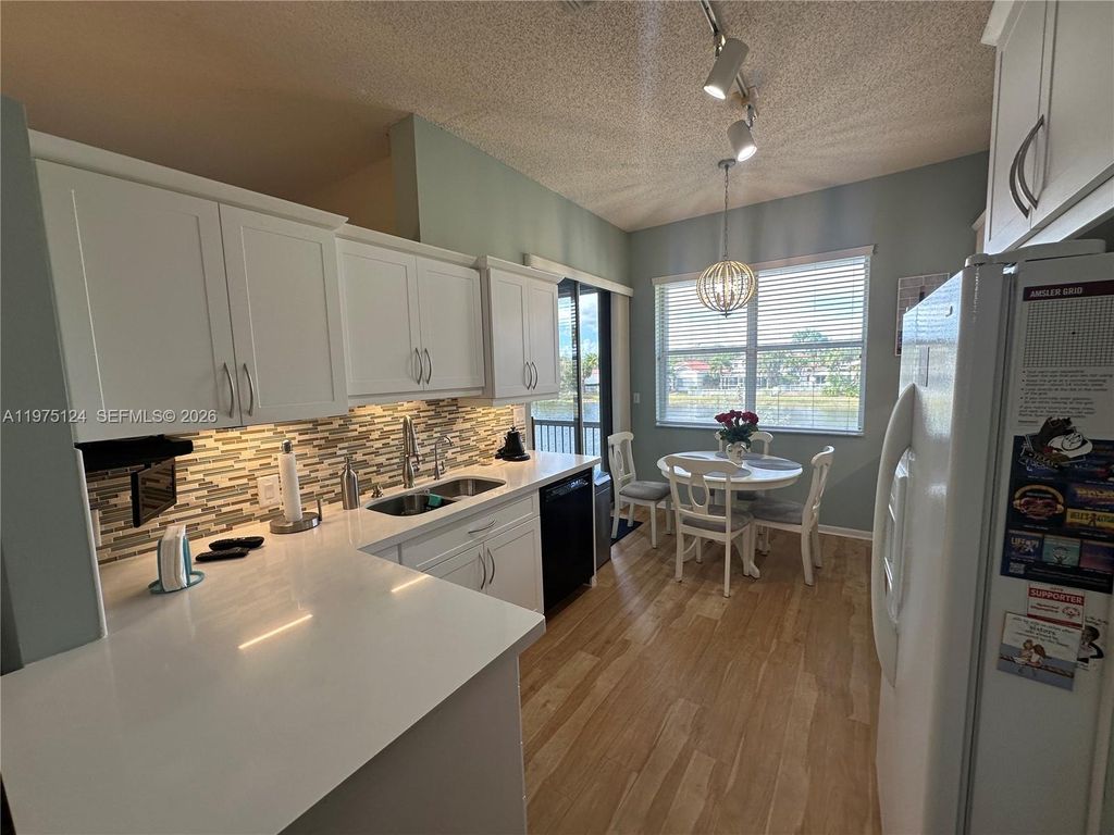 Photo of 14911 SW 15th St #14911, Pembroke Pines, FL 33027 (MLS # A11975124)