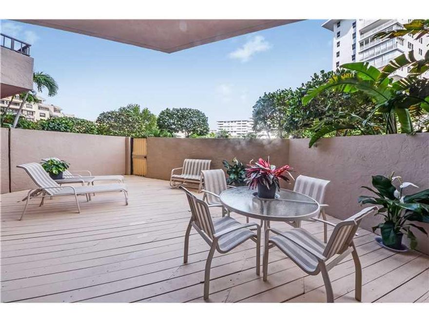 Two bedrooms, two baths plus den apartment. Split bedroom plan. Huge lanai terrace!  Only steps to the beach. interior finished with marble floors, custom woodwork and lighting!  immaculate condition!