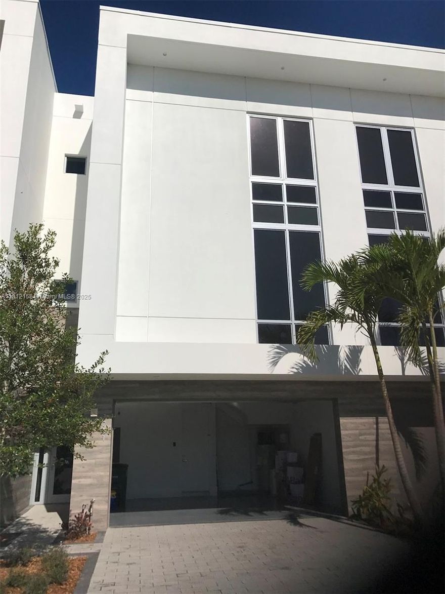 Step into this modern 3-bedroom, 3.5-bath townhouse in a quiet gated community. The home spans three levels, with a bedroom and full bath on the first floor—ideal for guests or an office. The second floor features a stylish kitchen, open living space, and a half bath. The top floor has two bedrooms, each with a private en-suite. Enjoy plenty of natural light from impact windows and sliding glass doors. The unit directly overlooks the community pool and landscaping, offering relaxing views from every floor.