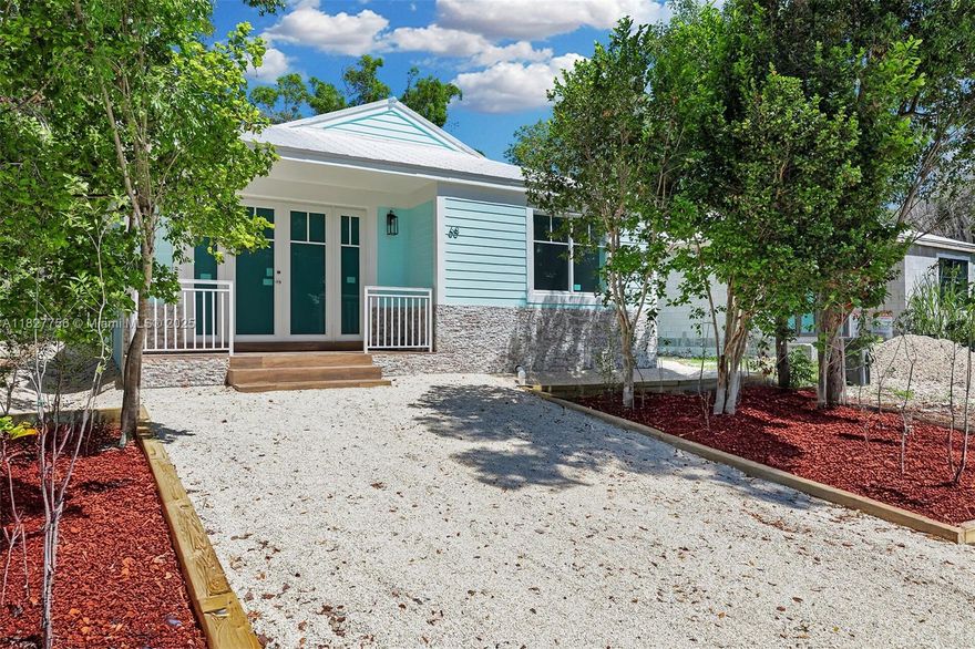 FINISHING TOUCHES ARE BEAUTIFUL!! FOR SALE - 2025 BRAND NEW CONSTRUCTION - UPPER KEY LARGO  
Discover modern island living in this stunning new construction home nestled in upper Key Largo's Paradise Point community. This single story 3 Bedroom - 2 Bathroom home offers a sleek contemporary design and gorgeous finishes throughout. It's open concept layout connects the living room-dining and kitchen area - creating an inviting space perfect for entertaining family and friends. Enjoy the privacy of a split plan design and indulge in beautifully designed spa-like bathrooms. This kitchen is a show piece! The chef-style kitchen features  stainless steel appliances, butcher block kitchen island, wine cooler and your own coffee bar!! This home truly checks all the boxes!