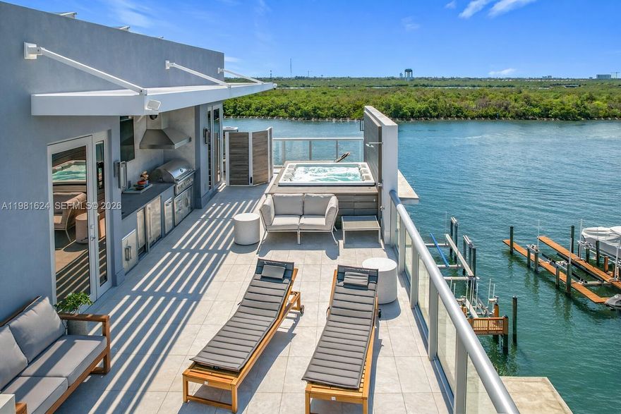 Corner waterfront 3BR/3.5BA townhome with ocean views to the east and Intracoastal views to the west from every room, with unobstructed sunrises and sunsets. Spanning 5 private levels, this residence features 13’ ceilings, a private panoramic elevator, Italian cabinetry, Gaggenau appliances, and integrated technology throughout. The full-floor primary suite includes dual walk-in closets and a spa shower with ocean views. A rooftop terrace with summer kitchen and jacuzzi enhances indoor-outdoor living. Included is a 55’ deeded marina slip with direct ocean access, no fixed bridges, and a double jet-ski lift.