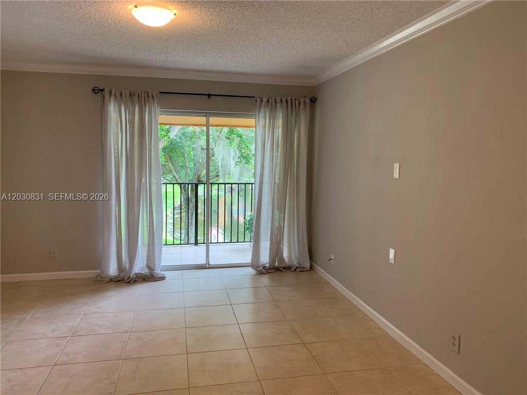 Photo of 10717 Cleary Blvd #202, Plantation, FL 33324 (MLS # A12030831)