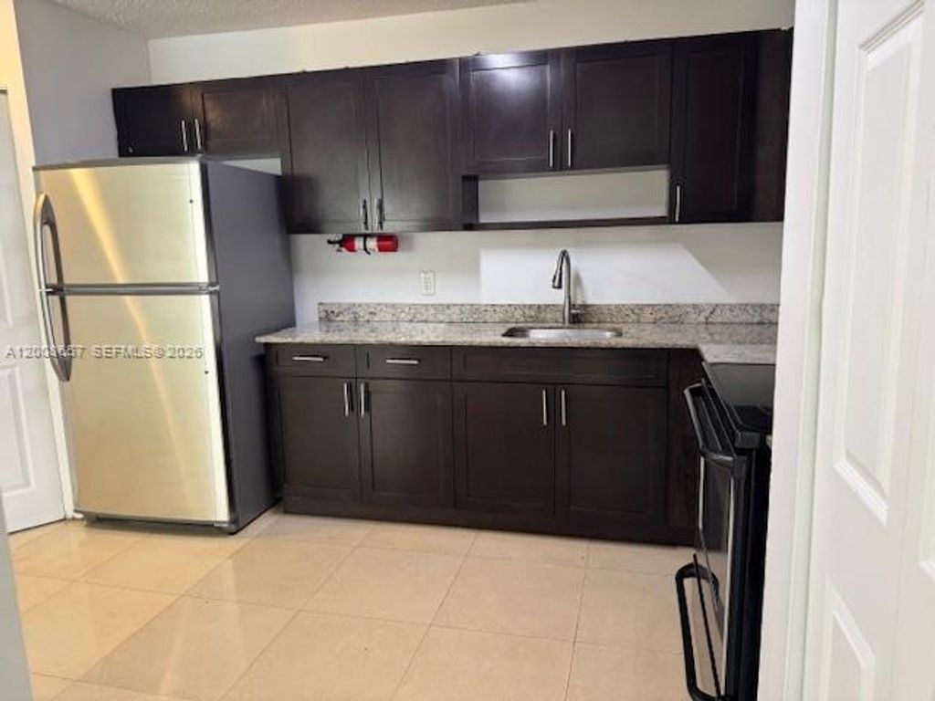 Photo of 5323 NW 24th St #118, Lauderhill, FL 33313 (MLS # A12008657)