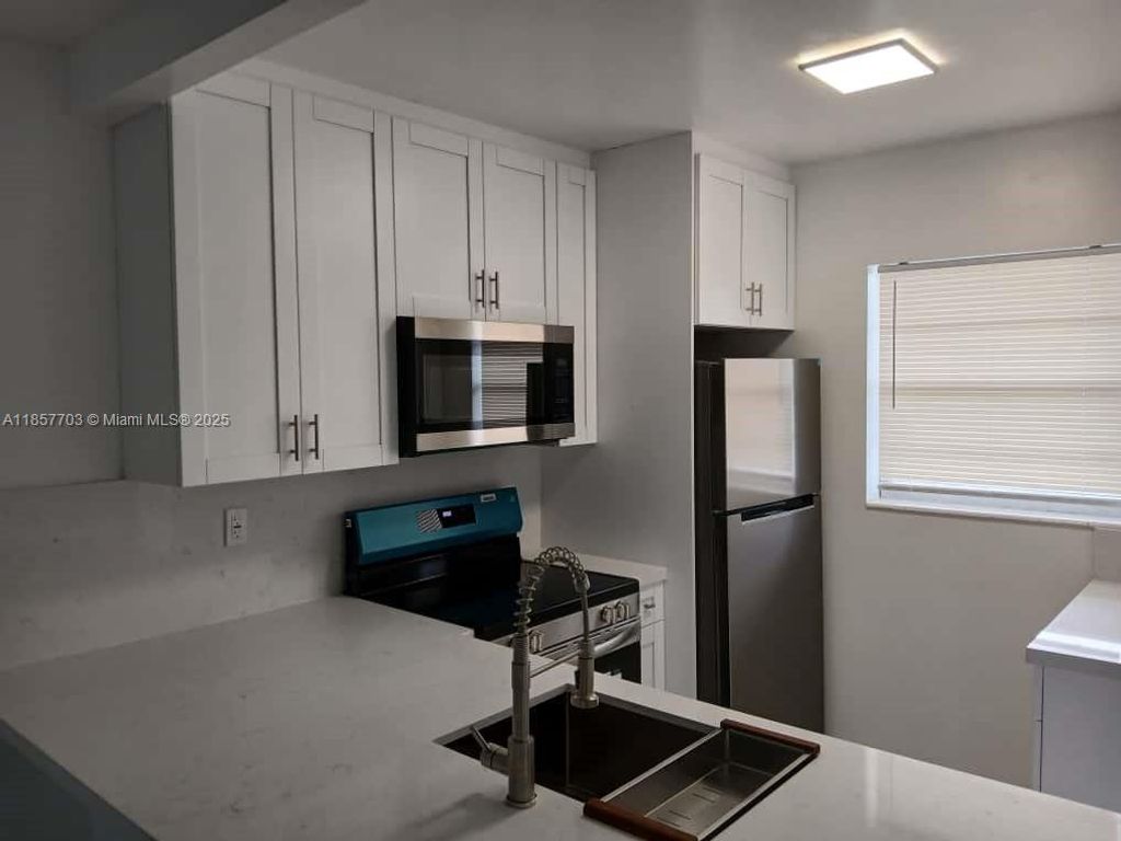 Photo of 5181 W Oakland Park Blvd #305, Lauderdale Lakes, FL 33313 (MLS # A11857703)