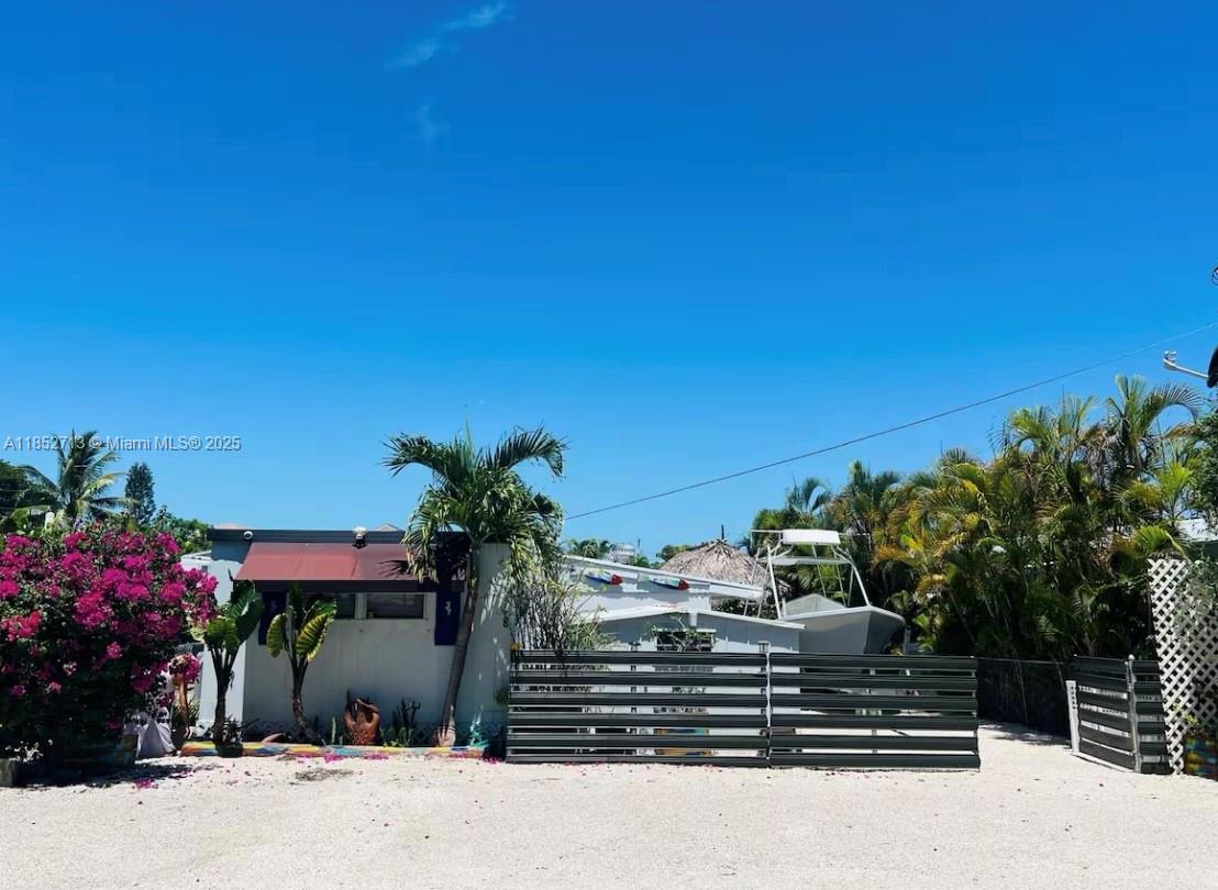 Welcome to your tropical escape in the beautiful Florida Keys! This remodeled oceanfront trailer offers unbeatable views and coastal charm with modern upgrades throughout. Enjoy breathtaking sunsets from your private cabana, unwind in the outdoor jacuzzi, and soak in the laid-back island lifestyle. Perfect for weekend getaways or full-time living, as well as rental opportunities. Enjoy 40 ft dock and a private marina! This slice of paradise has it all — comfort, location, and unforgettable scenery.