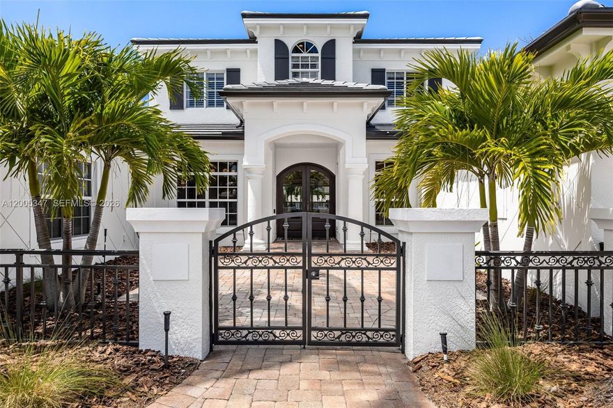 Welcome to luxury waterfront living in the highly desirable McGregor Isles, one of Fort Myers’ premier boating communities with direct Gulf access. Set on a quiet cul-de-sac, this custom home offers breathtaking intersecting canal views, SW rear exposure, and stunning sunsets, complemented by seamless indoor-outdoor living. A lush tropical entry leads to a light-filled open floor plan with coffered ceilings, designer finishes, and panoramic water views throughout. The remodeled chef’s kitchen features quartz countertops, an oversized island, Wolf ovens, gas cooktop, and Miele dishwasher, plus a climate-controlled wine cellar. Expansive sliding glass doors open to a resort-style outdoor space with a panoramic screen, pool, fireplace, and generous entertaining areas. The first-floor primary suite offers serene water views, dual walk-in closets, and a spa-inspired bath, while the main level also includes formal living and dining areas, a home office, half bath, and laundry room. Upstairs features a flexible loft-style living area with screened balcony and three bedrooms, including a private en-suite and Jack-and-Jill layout. Upgrades include white oak flooring, impact windows and doors, a whole-home generator, and a new 2025 roof on both home and boathouse. An extended dock and covered boathouse accommodate up to a 36-foot boat with no bridges and quick Gulf access—just minutes from beaches, shopping, and dining, offering the ideal blend of luxury, location, and lifestyle.