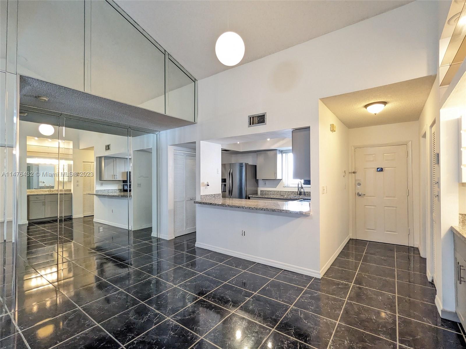 Centrally located near highway and shopping in gated Poinciana Village. Minutes from Miami Beach, Wynwood, and Edgewater. Tiled throughout, washer/dryer in unit, two assigned parking spaces - one covered, available immediately.