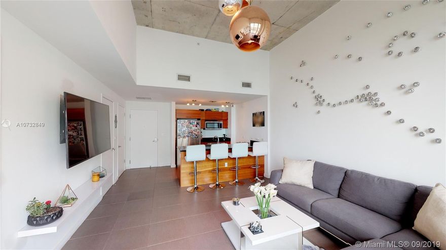 Spacious & Beautiful 1 bedroom/1.5 Bathroom Unit with high lofted ceilings. Unique to ONLY 7th Floor apartments.&#xD;&#xA;Italian kitchen, upgraded gray marble flooring with large bedroom w/ large walk-in closet, floor to ceiling glass with lots of natural sunlight. Midtown 4 gives you resort style living w/ full service amenities: concierge services, valet and your own assigned parking space, breathtaking roof top pool w/ direct bay views that include cabanas, BBQ Grills & jacuzzi. Fitness Center includes sauna/ steam. Location is a dream for your nightlife and all social activities and within walking distance to the Miami Design District and Wynnwood Arts District. Midtown Miami is just minutes from South Beach, Downtown, Miami, Brickell, Miami Airport. Available for rent first of October.