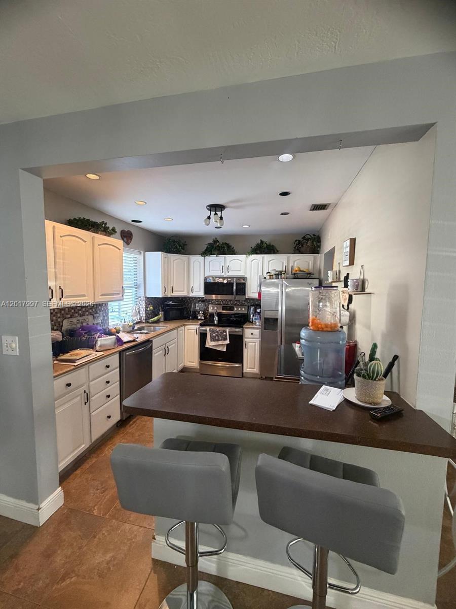 View photos, virtual tours, details... 621 SW 71st Ter