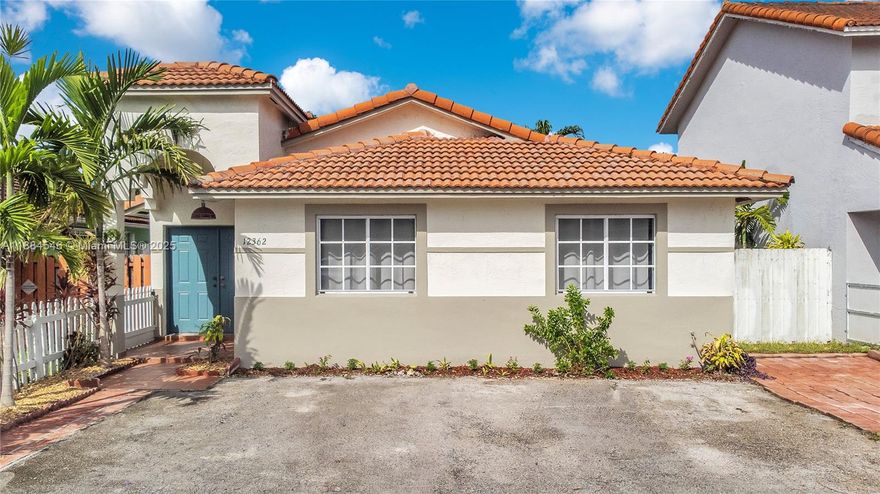 Welcome to this beautiful 3-bedroom, 2-bath home in Las Mansiones at Bel Air! Filled with natural light, this home offers a flexible layout with potential to convert to 4 bedrooms. Freshly painted inside and out, it features new flooring and baseboards for a modern touch. The gated side yard provides secure parking for a boat, jet skis, or ATV, and the driveway fits 3–4 cars. Enjoy peace of mind with new appliances including dishwasher, stove, dryer, and water heater. Very low HOA of just $17.50 per month. Conveniently located near the Turnpike, Okeechobee Road, I-75, and the Palmetto Expressway for easy commuting. This move-in-ready home is a fantastic opportunity to own in a sought-after community!