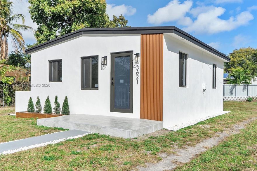 Fully renovated 2-bedroom home, completed with permits and high-quality upgrades throughout. Completely remodeled with no expense spared: new electrical system (wiring, meter, panel), brand-new PVC plumbing, and a new Rheem central A/C system with full ductwork. Hurricane-impact aluminum windows and doors, new roof, and aluminum fence for privacy and security. Modern kitchen with new cabinetry and brand-new appliances, plus washer and dryer included. Fully insulated roof and walls, new interior and exterior stucco, and premium finishes throughout. Spacious backyard — perfect for entertaining, kids, pets, or future additions. Move-in ready and built to last.