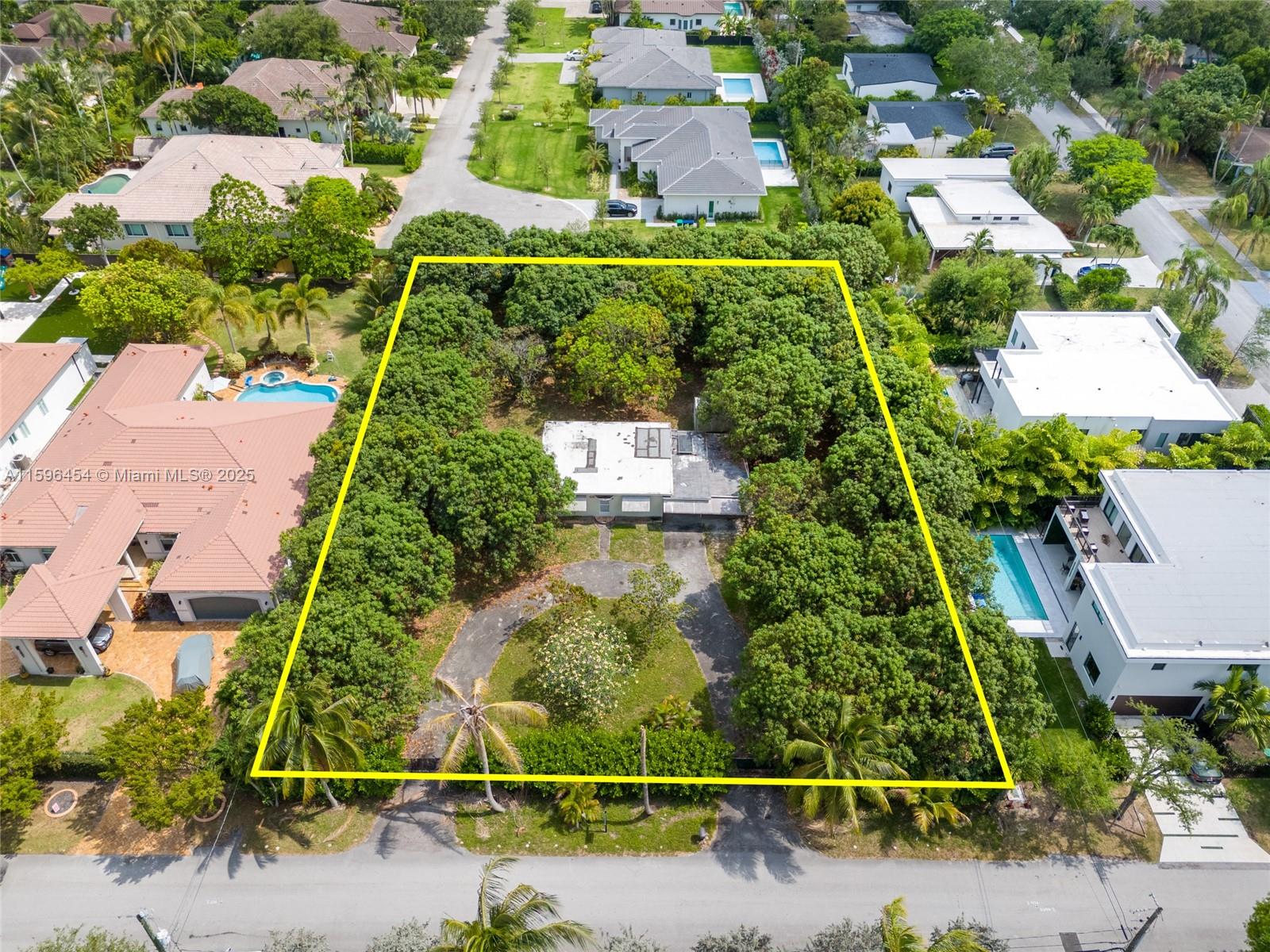 A rare opportunity to acquire prime land in lush Pinecrest. This expansive , 28,400sqft lot offers the perfect canvas to build your dream home, surrounded by mature trees in a serene neighborhood. Use the existing plans for a modern residence with over 8,700 sqft home or envision your own masterpiece. Plans have been approved by the City of Pinecrest and ready to build .