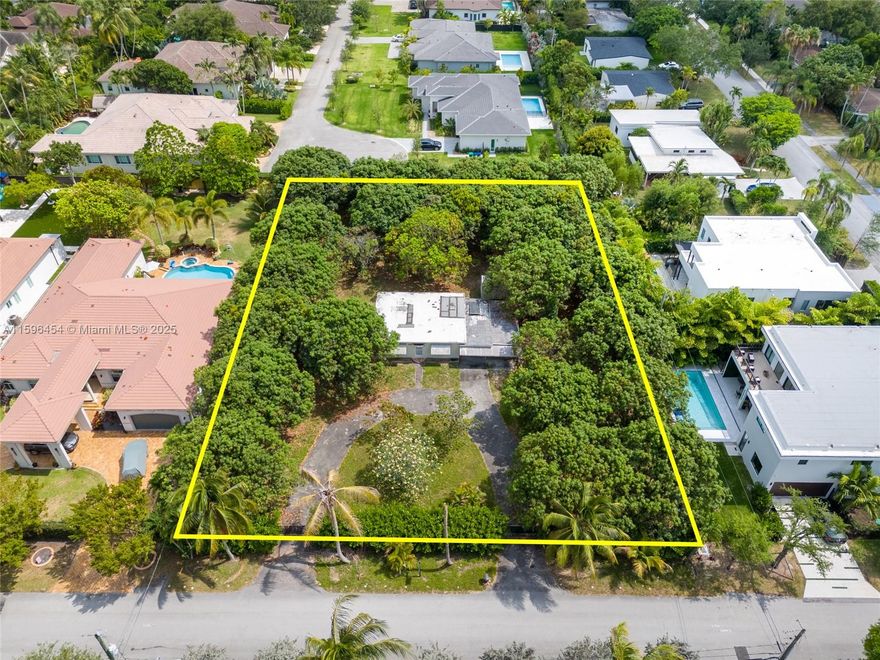A rare opportunity to acquire prime land in lush Pinecrest. This expansive , 28,400sqft lot offers the perfect canvas to build your dream home, surrounded by mature trees in a serene neighborhood. Use the existing plans for a modern residence with over 8,700 sqft home  or envision your own masterpiece. Plans have been approved by the City of Pinecrest and ready to build .
