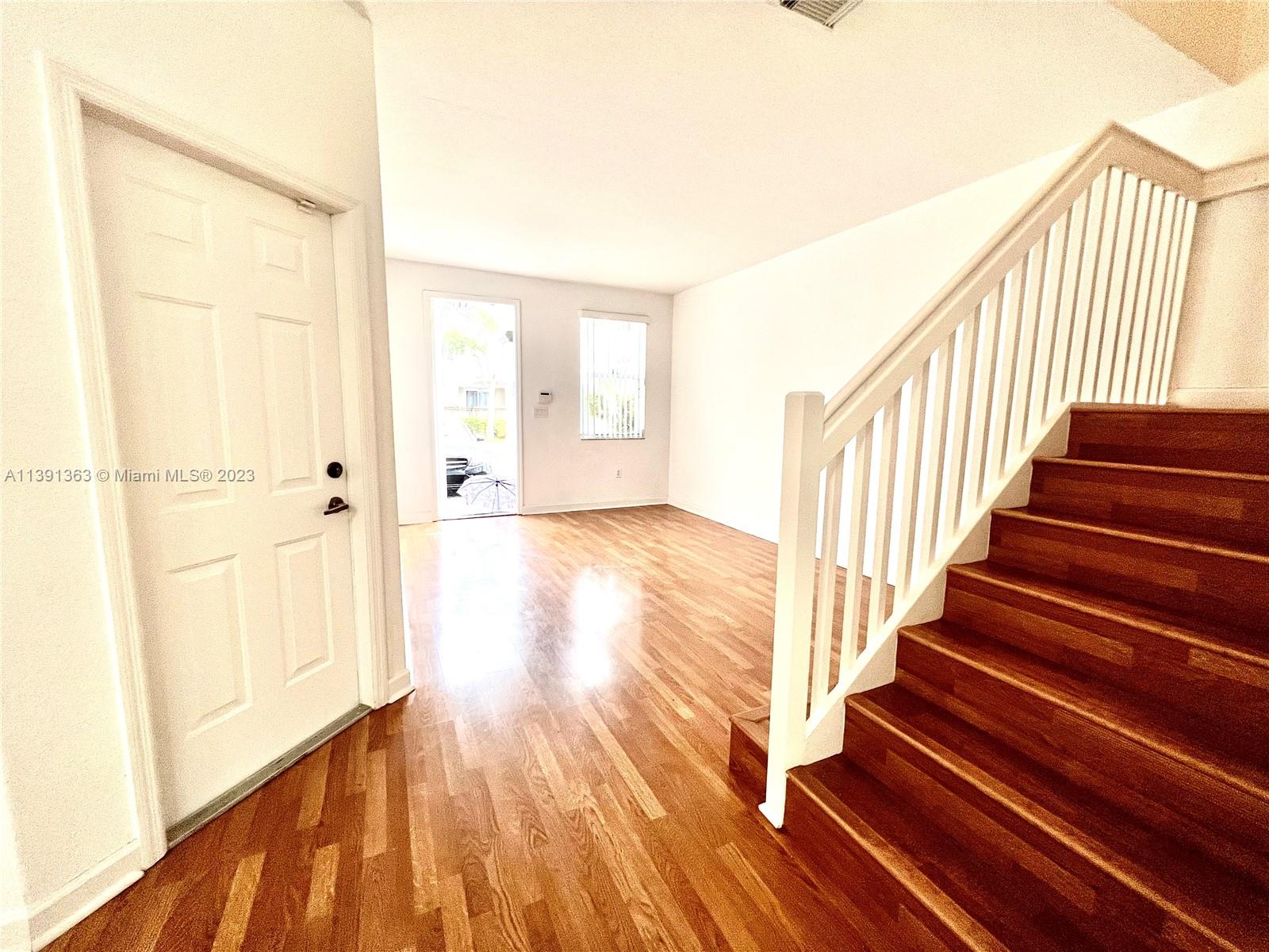 Spacious 2 story townhouse at Windward at Doral, 4 bedrooms, 2.5 bathrooms , family room, patio, recently painted, 1 car garage and 2 car driveway. New laminate floor, blinds, walk-in closets, fenced backyard, new LG washer and dryer on second floor, new kitchen cabinet doors, complex fenced, community pool and clubhouse. Close to Turnpike, Dolphin and International mall, Schools, parks, easy access to main streets and highways. Vacant! Easy To See!!!!