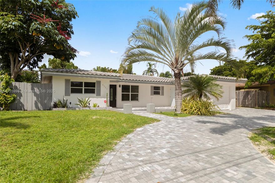 Beautiful, spacious 4 bedroom; 2 bath home located in a very desirable area. Open living/dining area with split bedrooms with large primary bedroom separate. Completely renovated: brand new barrel tile roof, new paver driveway; kitchen upgraded with new white cabinets, granite countertops , and brand new stainless steel appliances; bathrooms are also upgraded with new vanities; new flooring, new central air conditioner, and freshly painted. The home is located on a water canal which leads to a lake. Beautiful pool and patio. Great location with everything close by- shopping, restaurants, hospital, and near intracoastal and ocean. Easy to show!