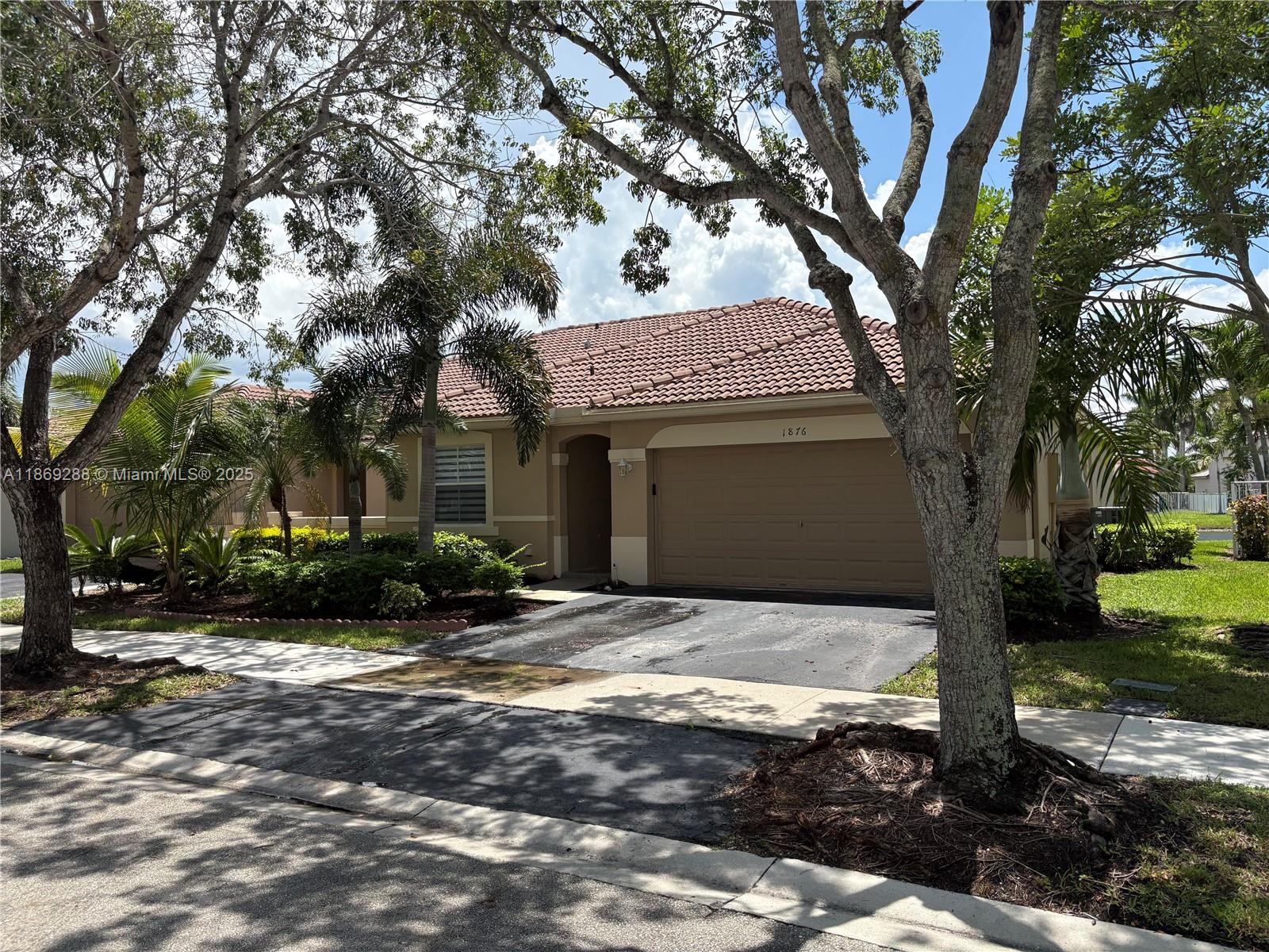 Absolutely Smashing! Like Brand New. Waterfront Too! Gated Entry Located in Weston at The Hammocks at Savanna.1 Story Villa Has 3 Br 2 Baths With a 2 Car Garage On a Lake.2 New Baths and Kitchen Cabinets and Countertops. New Tile Flooring Throughout. Inside Laundry, Spacious Open Floorplan .Excellent Schools and Access to Savannas Resort Style Clubhouse and Facilities...Vacant. Make Your Family Happy....Better Hurry!