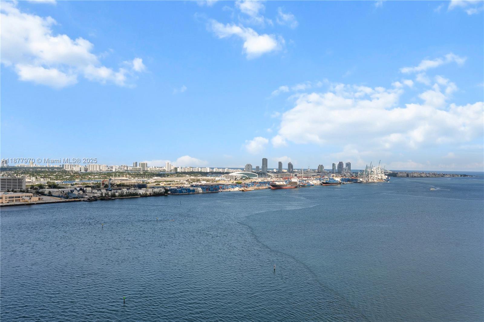 Breathtaking views of the Miami skyline, from Key Biscayne to Miami Beach, the Port of Miami and Downtown. Open and spacious living area featuring floor-to-ceiling sliding doors, large balcony, generously sized primary bedroom with two walk-in closets, versatile second bedroom, originally a den, with walk-in closet, Murphy bed, and desk. Two stand-alone parking spots and two side-by-side storage units. Resort-style amenities including a Bayfront pool, gym, spa, tennis & racquetball courts, along with concierge service and 24-hour security. This residence merges the tranquility of a private island with urban luxuries. The island boasts restaurants, marketplaces, and a scenic walkway encircling the area, Additional features include a secure bike room, common storage, valet service and more.