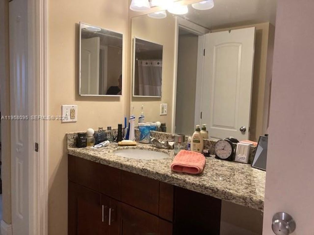 Photo of 2880 N Oakland Forest Dr #206, Oakland Park, FL 33309 (MLS # A11958095)