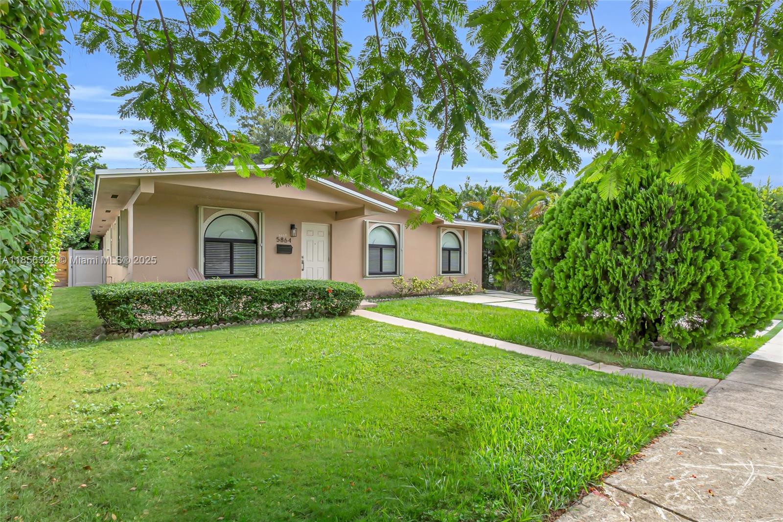 Guest House! This 3-bed, 2-bath home adjacent to South Miami & Coral Gables comes with a 1-bed, 1-bath guest house, with its own kitchen & laundry rm, perfect for in-laws or long-term guests.Backing directly onto the newly renovated South Miami Park, enjoy walking paths, playgrounds, & sports facilities right from your backyard.Zoned for & just one block from David Fairchild, an A-rated school.Recent updates include new impact windows in front,fresh interior paint,a new driveway, & brand-new A/C systems in the main & guest house. Inside, large custom closets provide abundant storage, & the main home’s open kitchen flows into the dining & family rooms, a spacious, connected layout perfect for entertaining or everyday living.A rare find combining location, versatility, & park-front living!