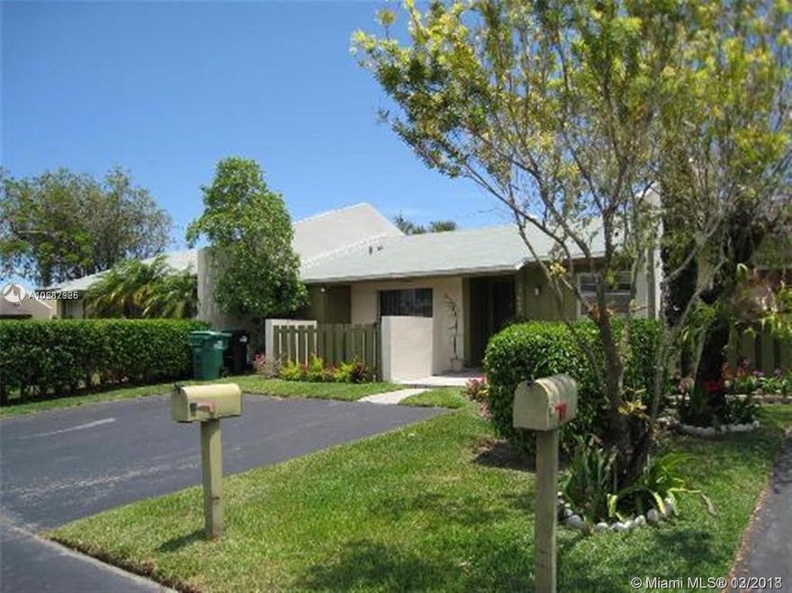 Updated single story townhouse , tiled floors throughout, shaker style kitchen wooden cabinets with granite counter tops. Updated bathrooms - dual sinks in master, landscaped garden in front, covered patio in the back. Close to shopping, great schools as well!