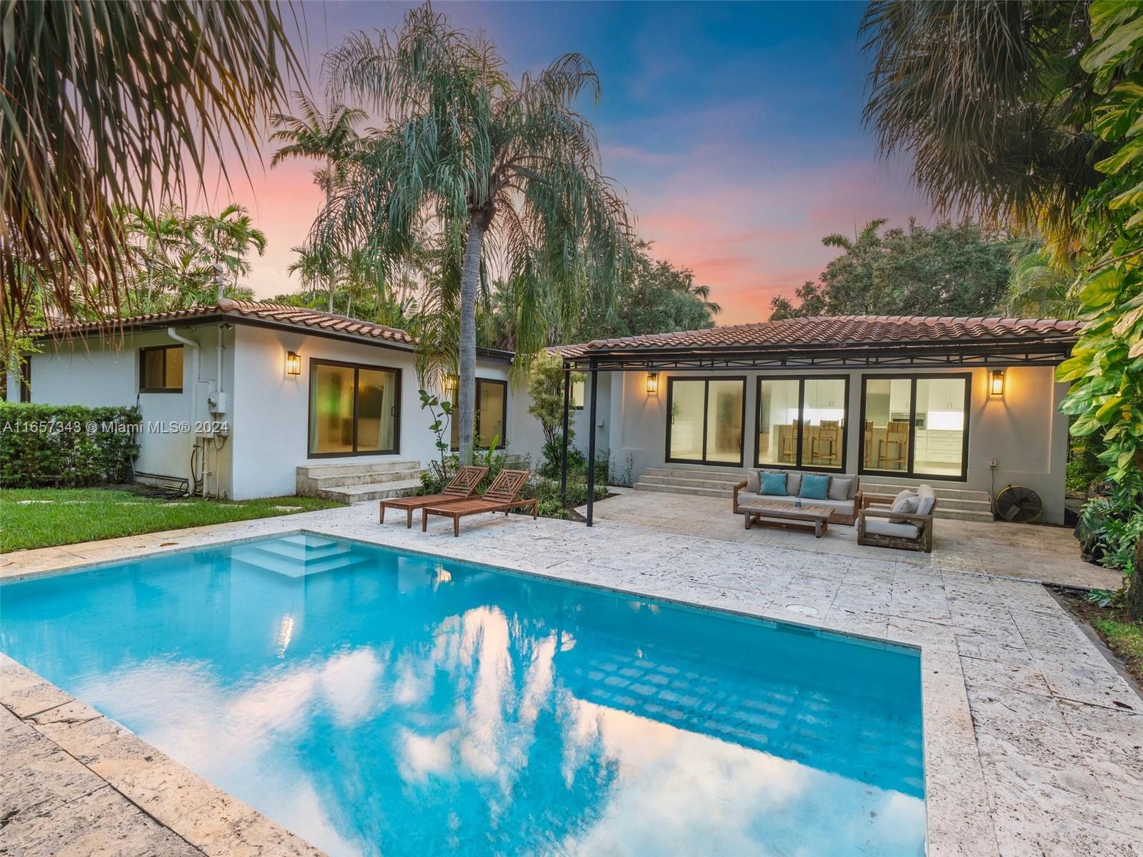 Seller financing available! Call listing agent for details. Welcome to the Grand Dame of Miami Shores! This magnificent pool home in East Miami Shores has been substantially redone.4 bd, 4 bth, with over 3100 SF living space has been crafted for the most discerning buyer in mind. This home exudes elegance & luxury from the minute you walk in. Spacious formal living & dining room that connects into the chef-inspired kitchen, the wow factor of the home. The kitchen features an oversized marble countertop, custom-made cabinets & Thermador appliances. Large laundry & pantry room. Split bedroom plan. Master bedroom w/ 2 walk-in closets, overlooks pool & lush landscaping. Designer bathroom with dual sinks, free-standing soaking tub & rain shower, a truly Zen experience. Impressive Florida room.