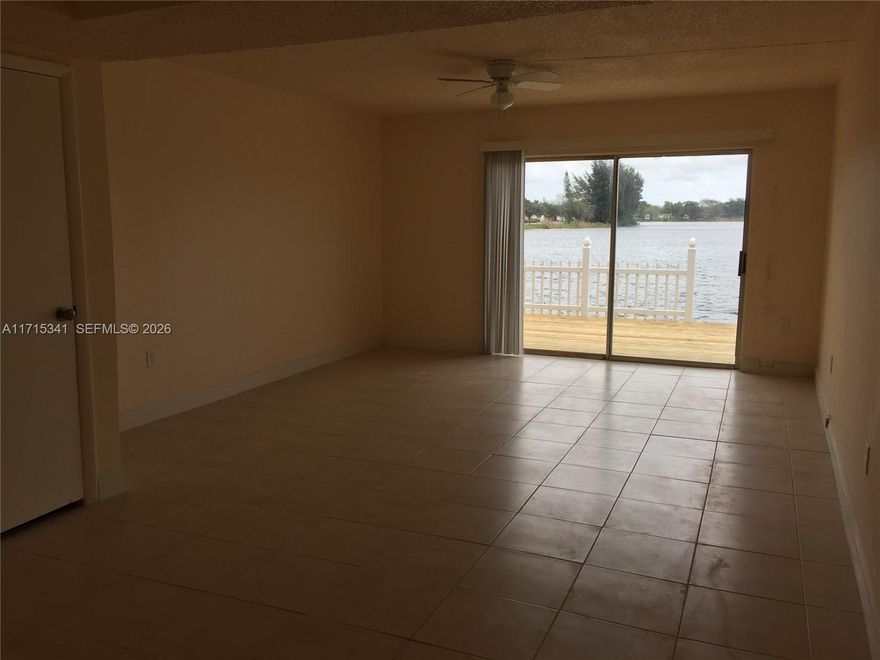 Very charming lakefront townhouse with dock! INCREDIBLE lake-front views. Spacious 2 bedrooms/1.5 bathrooms. Tile floors. Washer/dryer inside unit. 2 assigned parking spots. Great location close to major highways, Nova University, the Hard Rock Hotel, restaurants, and more. Walking distance to the city Park. Seller financing available. Great home and/or investment opportunity! Currently rented. Per association, roofs were redone in 2020.