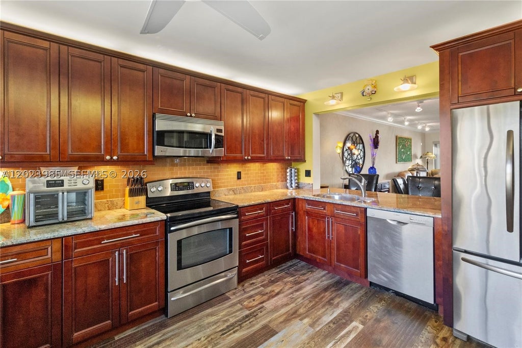 Photo of 5519 Fairway Park Dr #203, Boynton Beach, FL 33437 (MLS # A12023985)