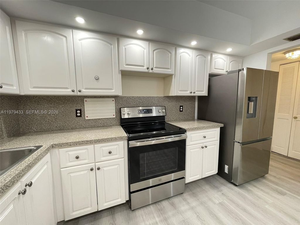 Photo of 3800 N Hills Dr #308, Hollywood, FL 33021 (MLS # A11979433)