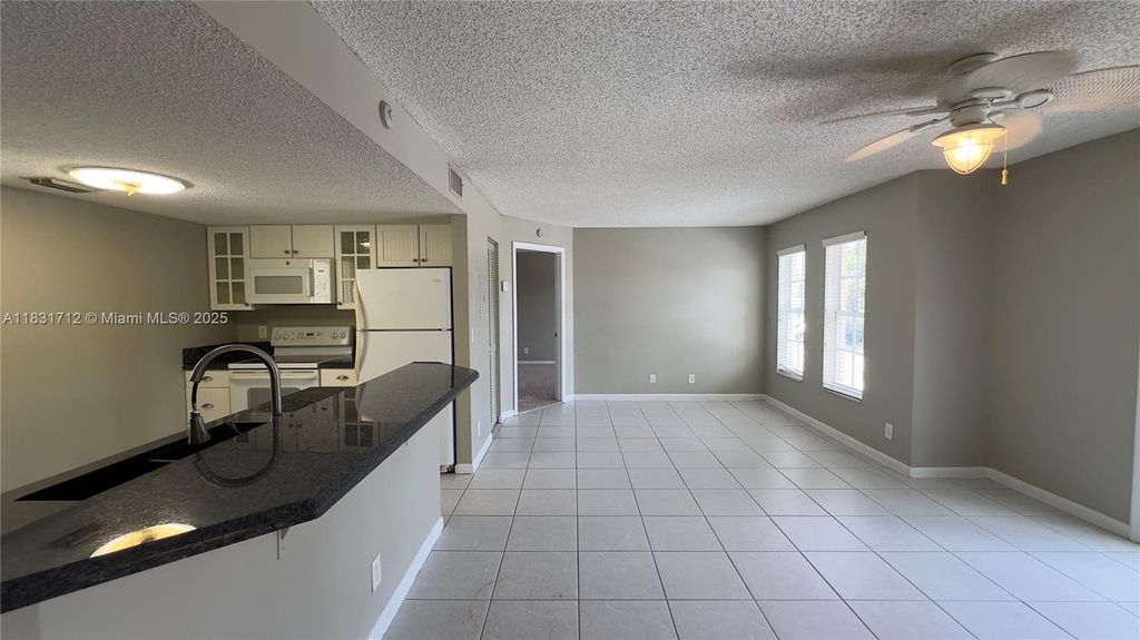 Photo of 1145 Lake Shore Dr #205, Lake Park, FL 33403 (MLS # A11831712)