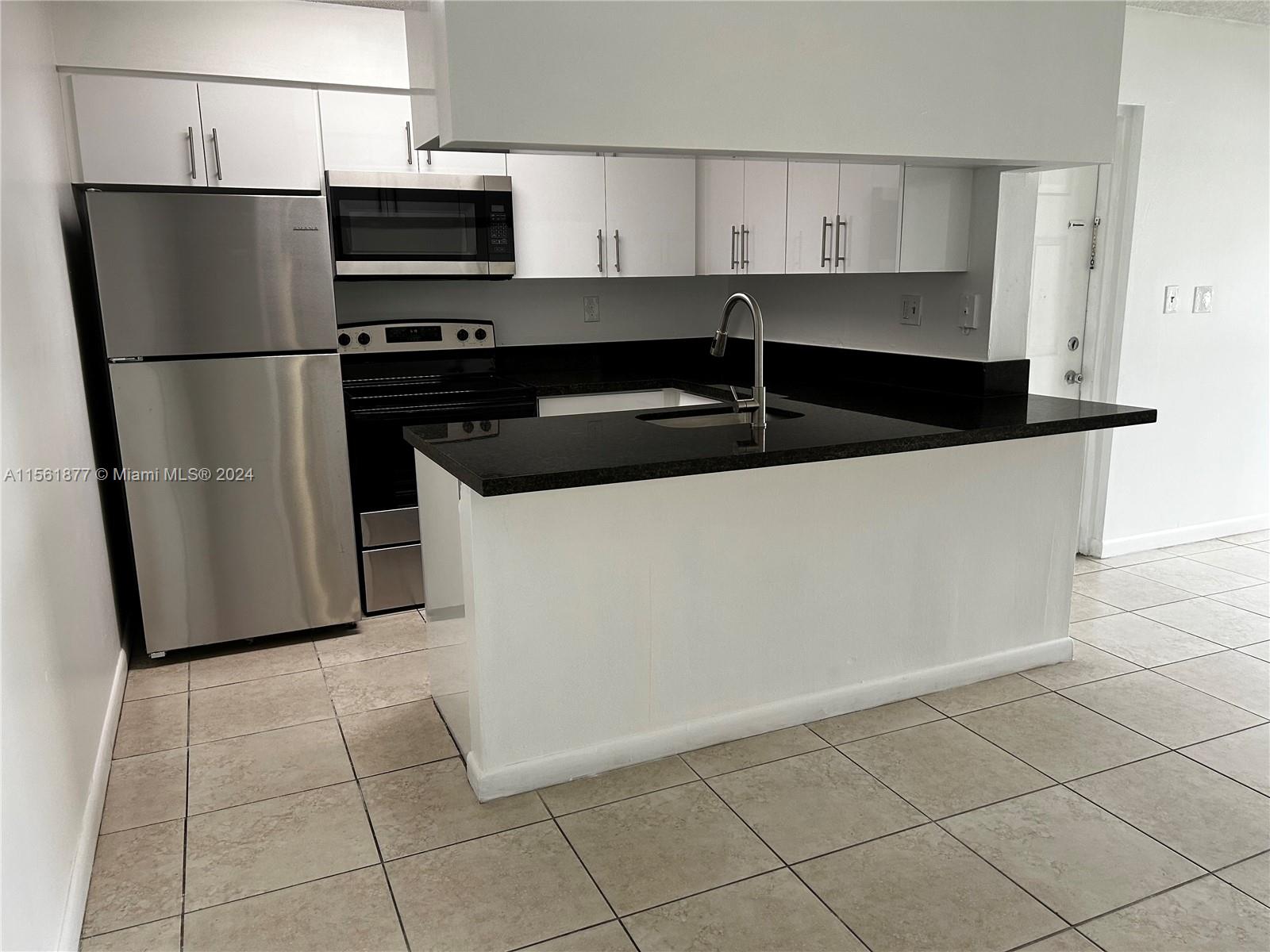 Beautiful and cozy, this unit boasts a brand new kitchen cabinetry, with granite counters and brand new appliances. It also includes washer and dryer inside the apartment. You will be the first one to use this amazing kitchen! This unit will not last. Only one car allowed per apartment. Tenant is responsible for water bill.