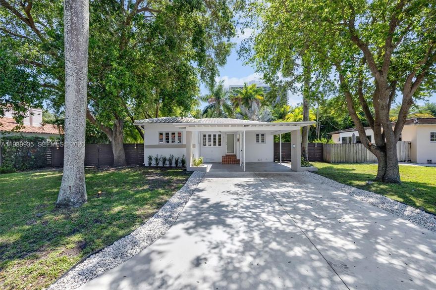 Beautifully renovated Mid Century Modern residence in Historic Bayside, blending warm natural materials with clean contemporary design. Open concept layout with a sleek kitchen featuring walnut cabinetry, stone countertops, induction cooktop, and an oversized island that flows into the living and dining areas. Light wood flooring, impact windows and doors, and abundant natural light throughout. Glass doors lead to a private backyard with a pool, expansive terrace, and lush tropical landscaping for complete privacy. Set on a 7,500 SF lot with room to expand.
Updated bathrooms, well sized bedrooms, and a functional layout ideal for end users or investors. Turnkey opportunity in one of Miami’s most desirable neighborhoods.