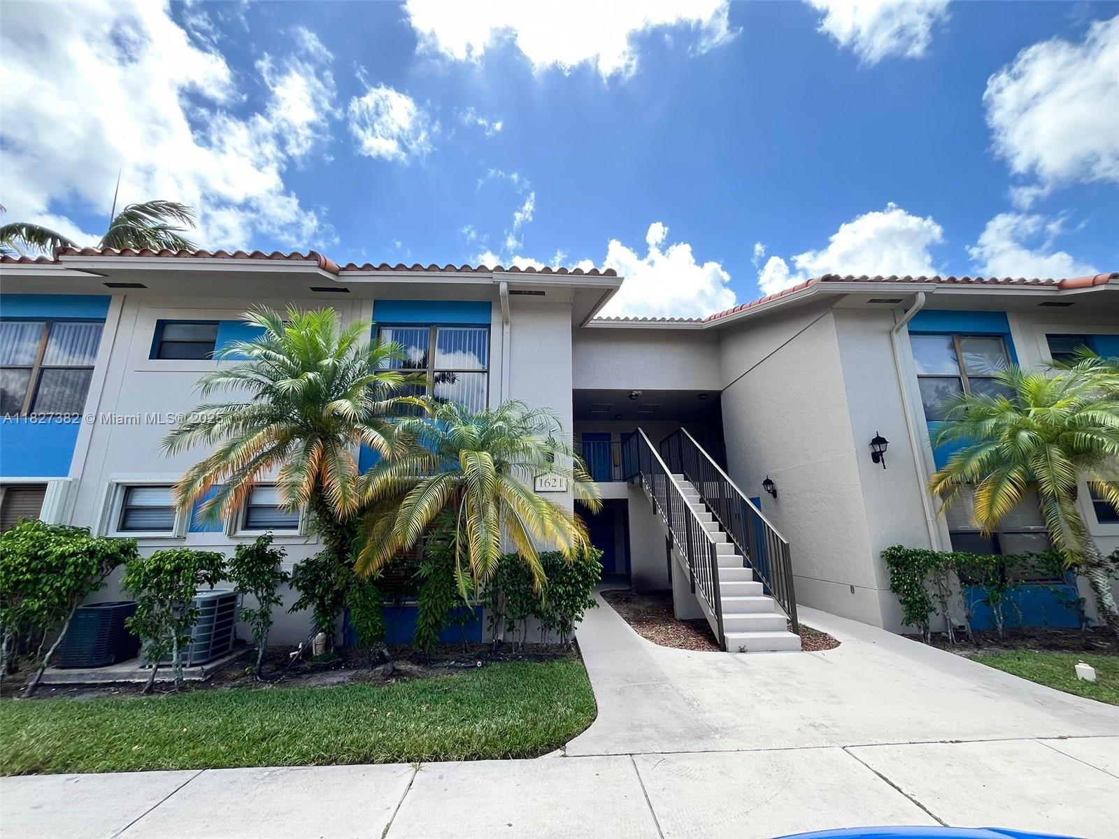 Bright and spacious 2-bedroom, 2-bath first-floor condo in Palm Beach Place! This freshly painted unit features a split floor plan, an updated kitchen with granite countertops, stainless steel appliances, and beautiful wood cabinetry. Enjoy tile flooring in the main areas and wood laminate floors in the bedrooms. Includes a full-sized washer and dryer for added convenience. Community amenities include a pool, tennis courts, and more. Ideally located near schools, shopping, and dining. This move-in-ready condo combines comfort, style, and convenience – don’t miss out!.