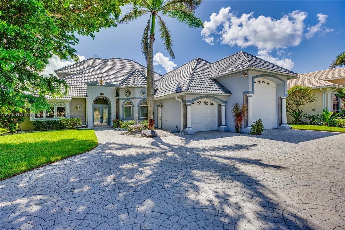 Custom-Built Estate with Lake & Golf Course Views! Nestled in the gated Water’s Edge community along the Caloosahatchee, this 3,238 sq. ft. 3BD/3.5BA home blends elegance with comfort. Built in 1994 and meticulously cared for by its original owner, it boasts soaring ceilings, an open layout, and breathtaking views. The spacious screened lanai offers an inground spa, built-in grill, and serene lakefront vistas. The primary suite is on the main level, while two ensuite bedrooms upstairs open to a private balcony. Additional features include a home office (or 4th bedroom), RV garage with hookups, updated tile roof (2023), 2 HVAC systems, hurricane shutters, and lush landscaping. Partially furnished if desired. HOA amenities include boat slips, storage, launch to the river, pool and more!